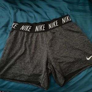 Dark grey Nike shorts.